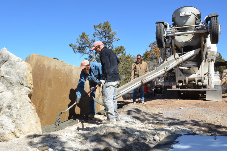 Concrete slab being poured at a construction site